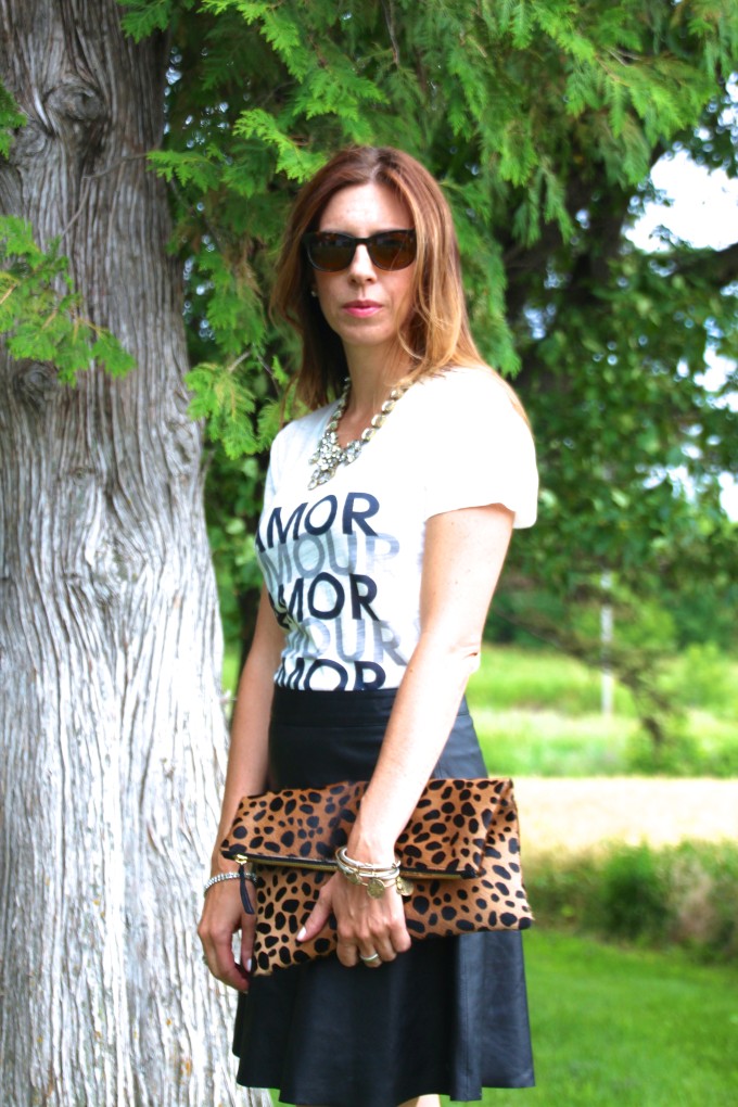black leather skirt, amour, graphic tee, leopard clutch, warby parker, david yurman