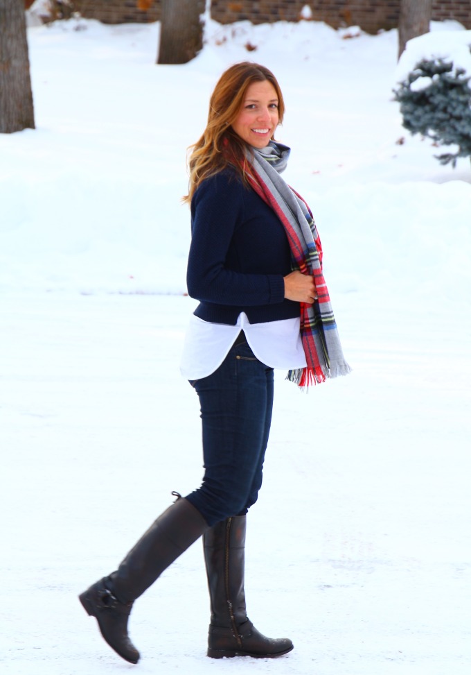 bundled up in layers of navy and riding boots